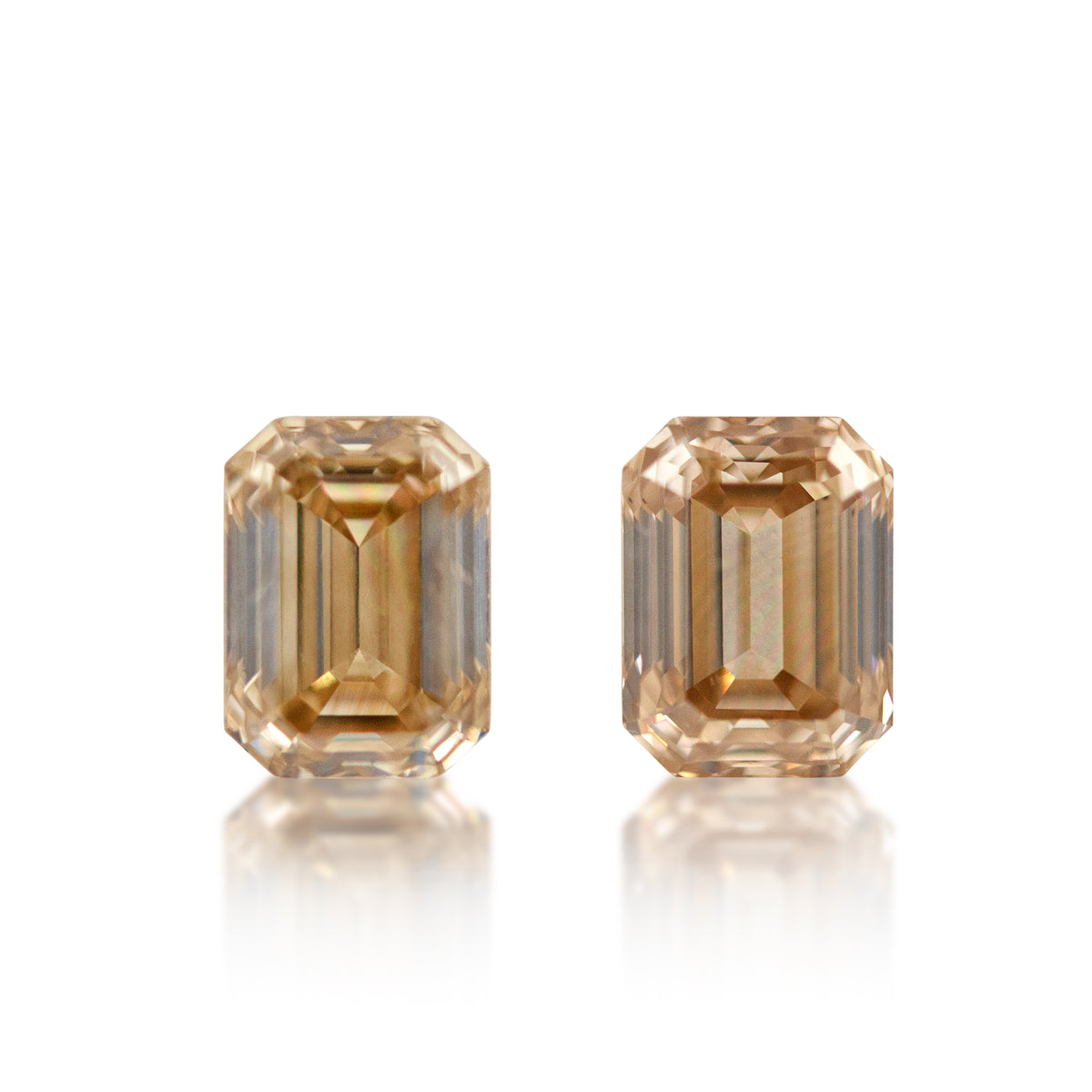 Two emerald cut Australian champagne diamonds, 1.50 ct total matching pair of natural loose stones