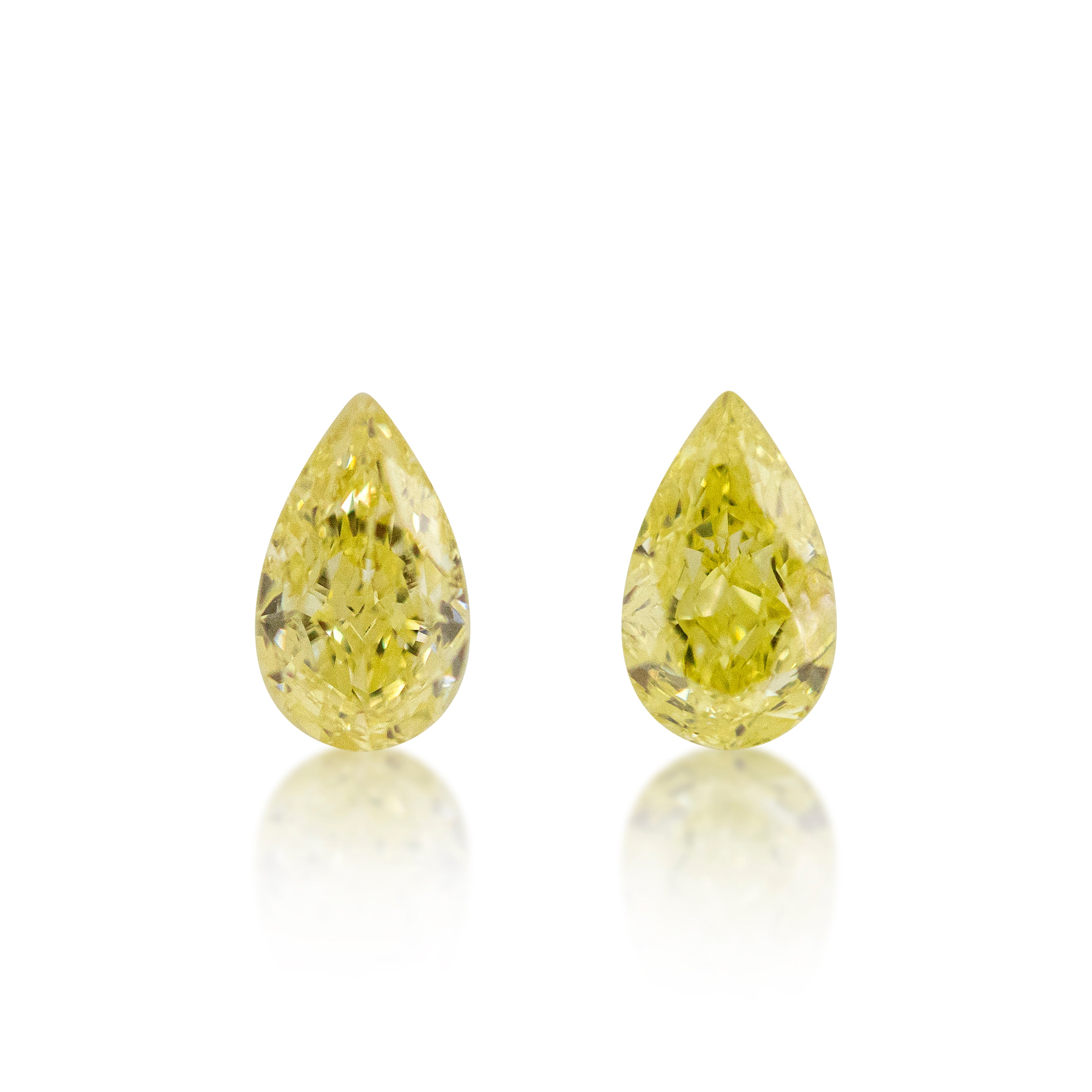 2 = 0.81 cts Pear Cut Fancy Yellow Diamonds