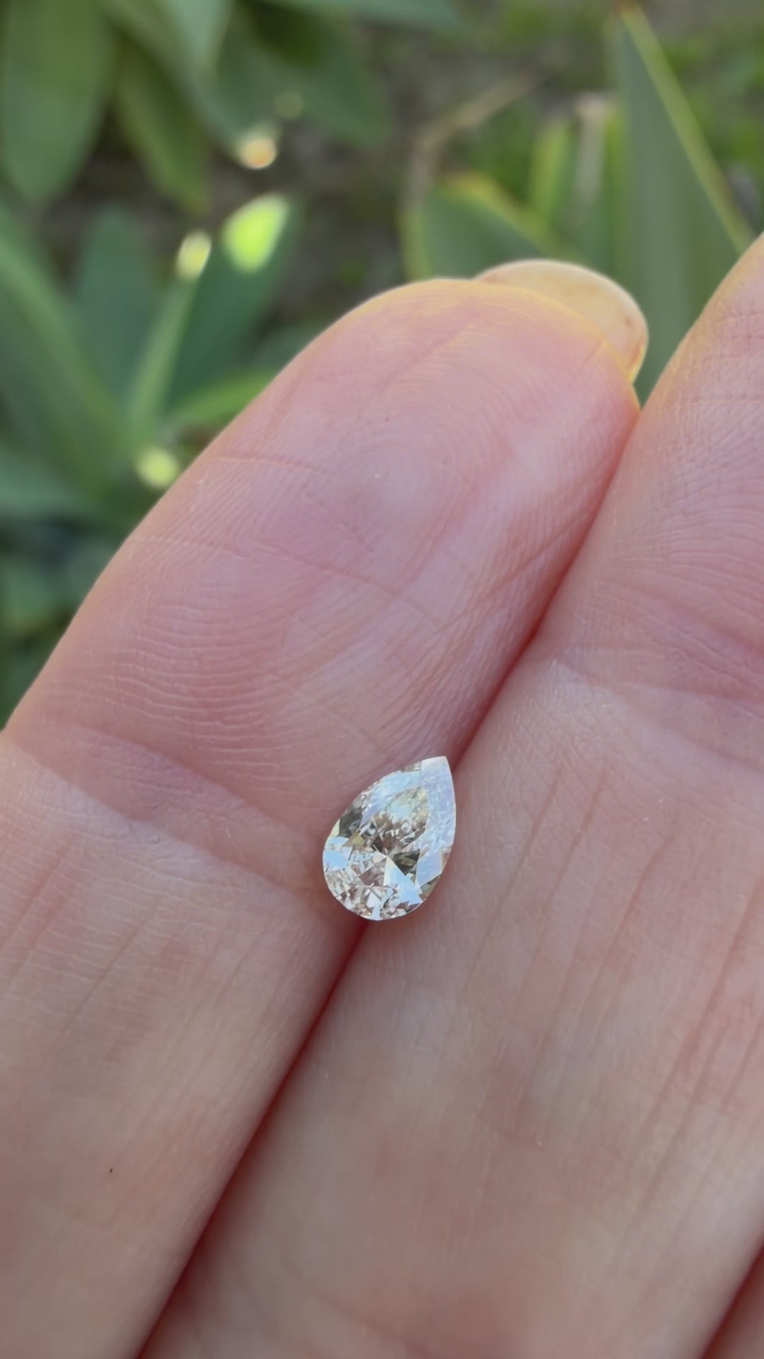 A single pear-cut diamond light champagne diamond